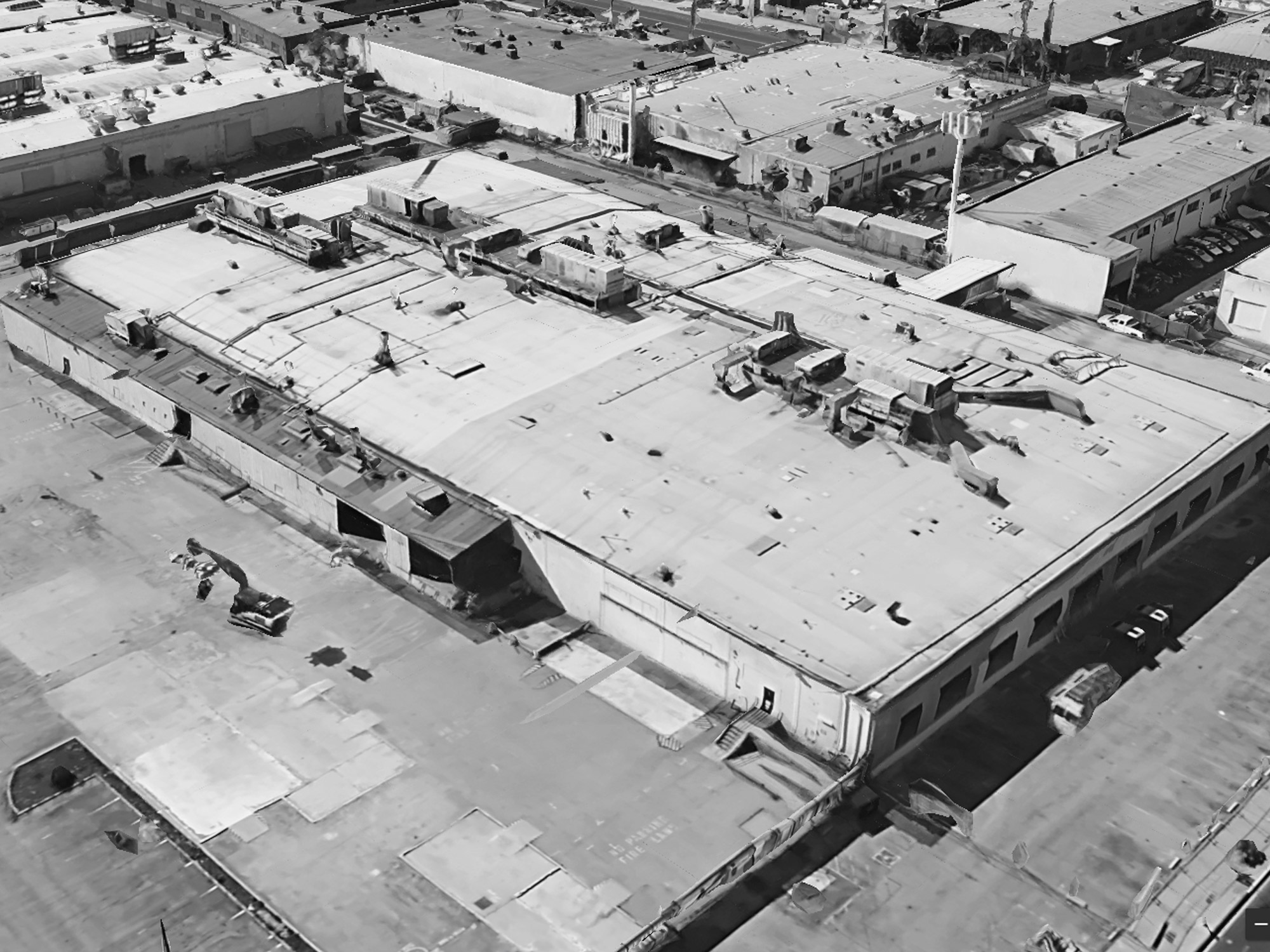 Aerial view of former warehouse in black and white.